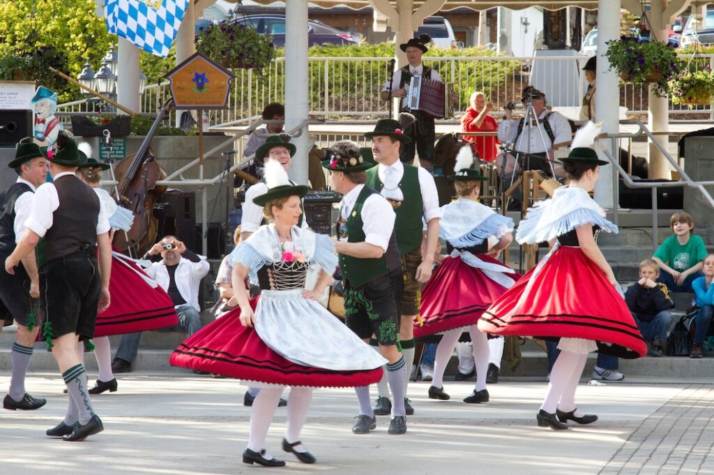 People from Leavenworth in Washington Performing Dance Wearing Traditional Bavarian Attire during Maifest