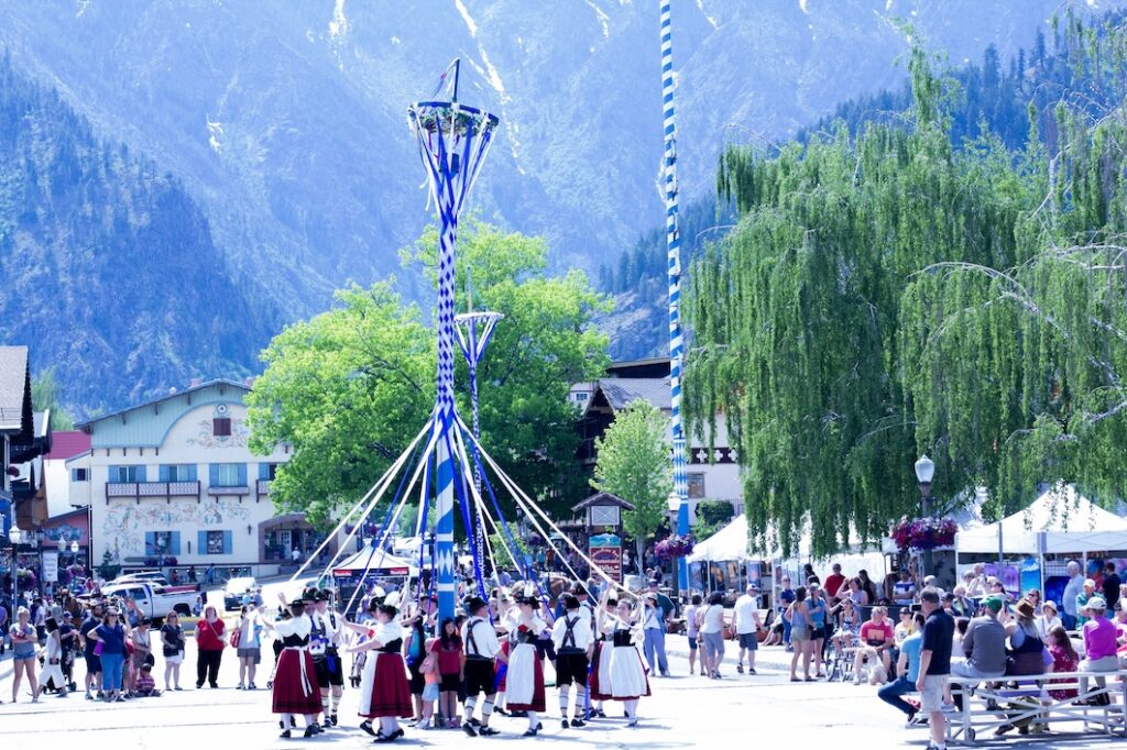 People from Leavenworth in Washington Performing Maypole Dance Wearing Traditional Bavarian Attire during Maifest